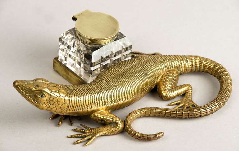 Brass salamander inkstand, glass eyes, cut glass inkwell with hinged brass lid.

Item #7233