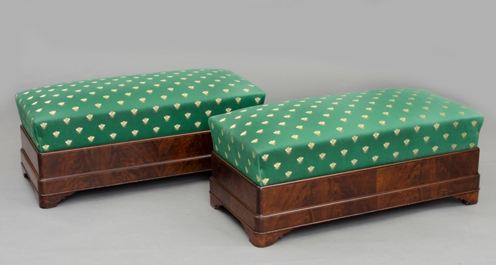 Pair American Boston Empire boldly figured mahogany window seats or benches on shaped bracket feet.  Upholstered in emerald green silk decorated with  bumble bees.