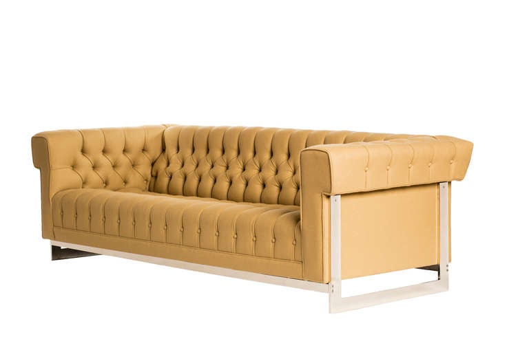 A striking, modern take on the classic Chesterfield sofa after Stendig, newly upholstered in rich camel colored Maharam wool felt and replated. The body is attached to an expansive chrome frame giving the appearance that it's floating.