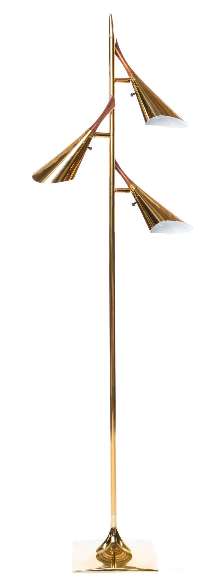 Restored to perfection, this Laurel iconic tri-head adjustable floor lamp, with walnut details, will illuminate any task area or cast indirect light around its local setting.  Impeccably re-plated and rewired, each head topped with a warm wood