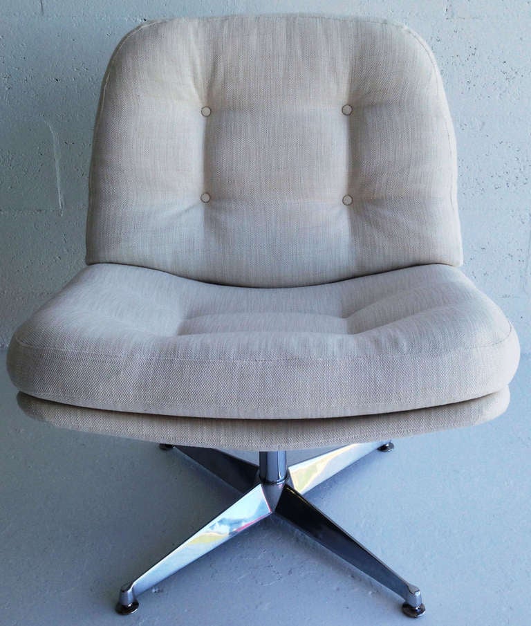 Only one now available. 

This Space Age lounge chair by Founders swivels 360• silently on a chrome cylinder supported by a mirror-finish classic star-base.  Newly upholstered in off-white linen the individual back and seat cushions are attached