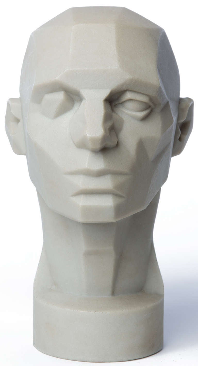 This polypropylene model was created by John Asaro as a tool for rendering the human head. The left side shows the basic structure of the head's planes as seen in a round younger face. The right side shows a more complex structure that is