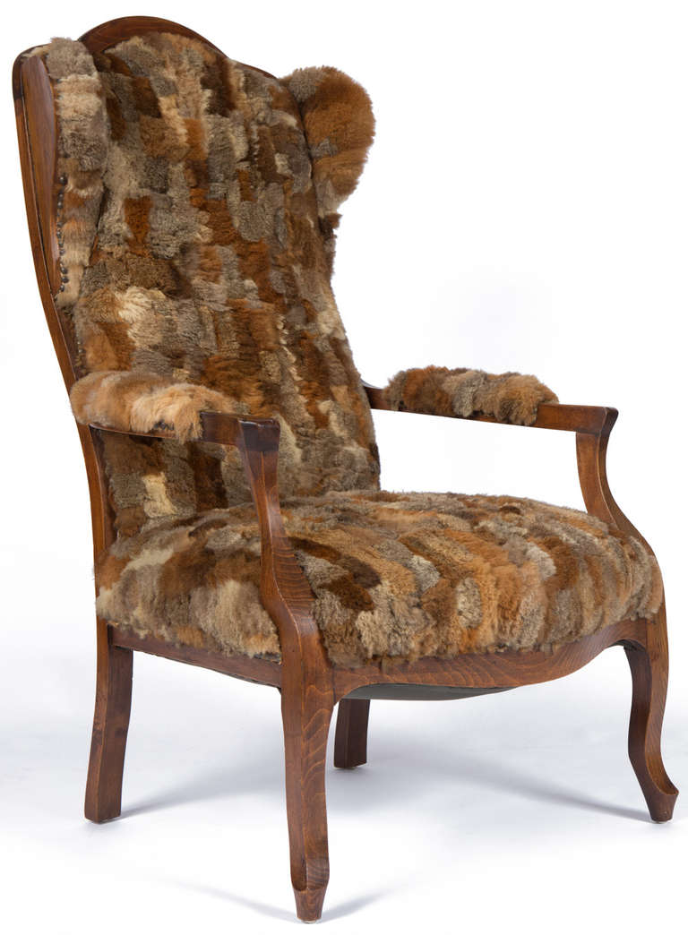 This whimsical wingback chair is upholstered in rabbit fur mosaic supported by four gracefully constructed wooden cabriole legs. A stunning example of 17th century English style fit for royalty.