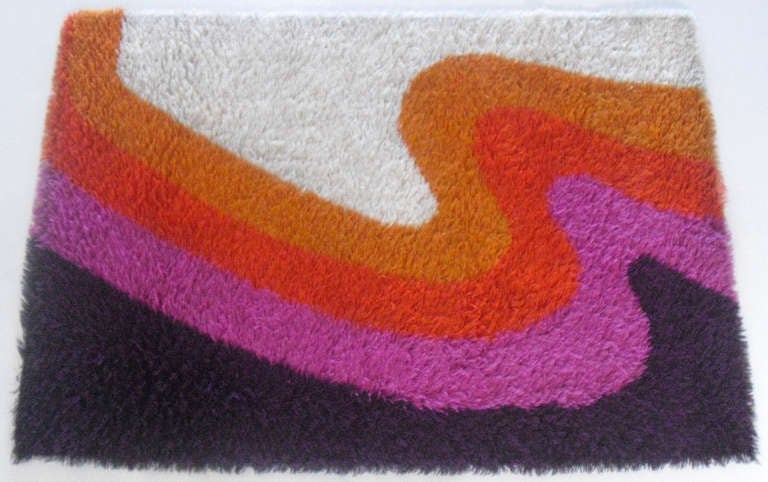 Ninety-three million miles from golden flares, a wave burst of deep purple, lavender, orange, amber and white, splits the megahertz, and creates within a singularity of emotion. 

100 percent pure wool with a 2.5cm Turkish Yatak-inspired pile on