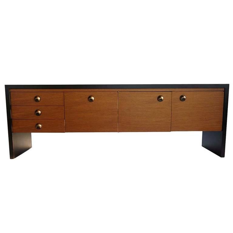 Meticulously restored to near original showroom perfection, this powerfully commanding piece is made of golden oak and rich rosewood, decorated with ergonomic bronze pulls and finished in a soft satin luster.