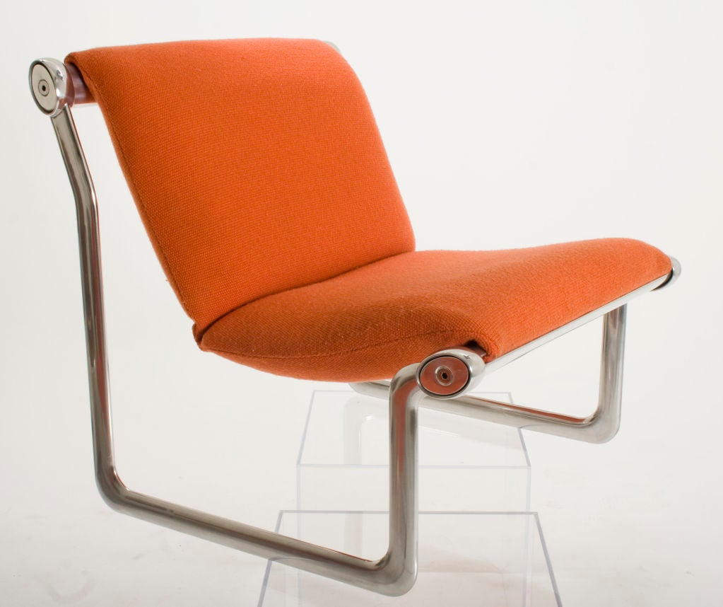 Amazing pair of Lounge Chairs designed by Morrison and Hannah in 1971 and manufactured by Knoll from 1972 - 1977. Original bonfire-orange fabric upholstery and brilliantly cleaned and polished aluminum frame and stretchers.
