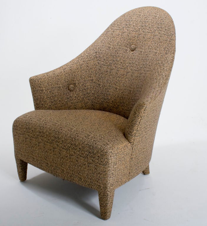A sleek and stylish chair in delicately textured pacific shells pattern. Fabric has an almost iridescent quality.
