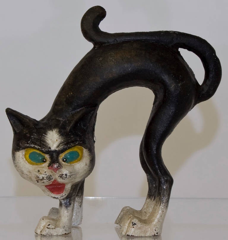 This menacing little feline will greet your guests at the door, support your books or weight your papers. Wherever this expressive piece of decorative art finds itself it's sure to bring a smile. Original paint.