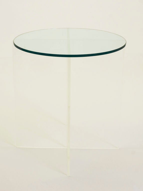 This modern, sleek side table features an x-shaped interlocking acrylic base, which supports a 1/4