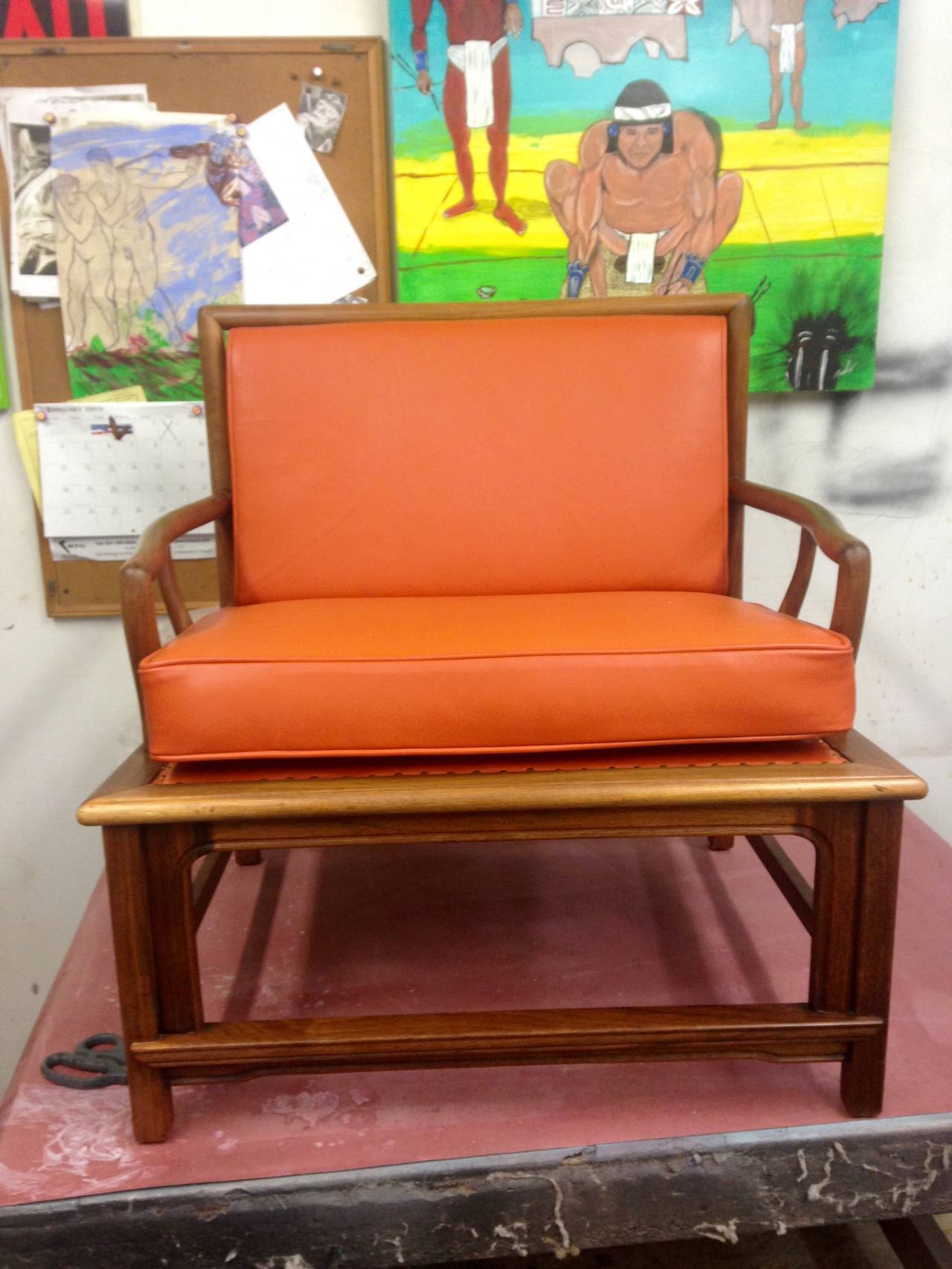 A great looking pair of Asian Modern style chairs that were made by Widdicomb. They had Widdicomb sprinted on the webbing, which has been completely redone and these chairs have been re-upholstered in a great orange leather.
Nice styling and finish