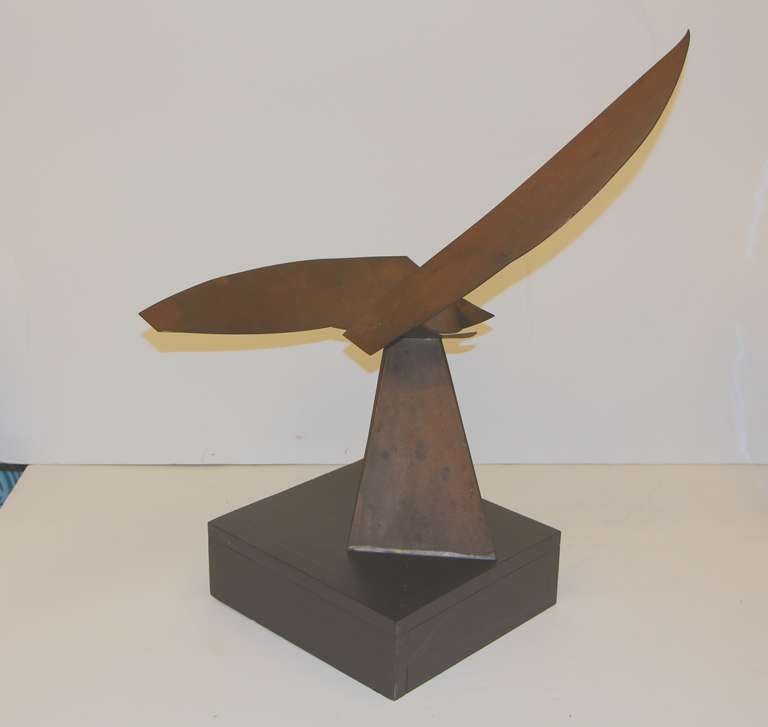 An exquisite copper handmade sculpture. It is mounted in a painted wood base. Great form and style. Piece looks to be from the 1960s.