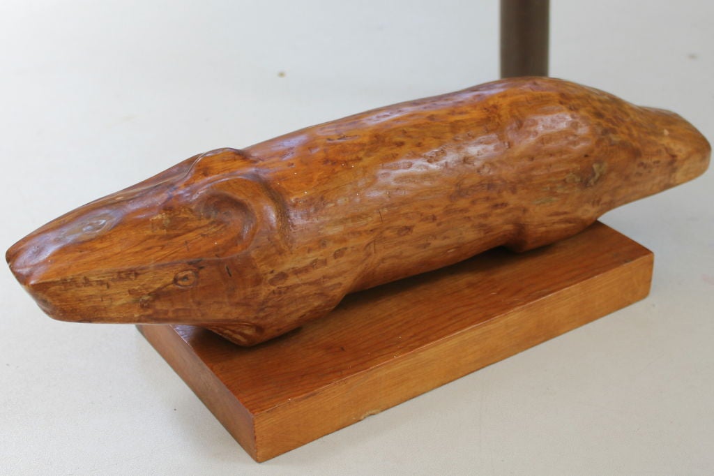 A great wood Folk Art carving of an alligator or crocodile. It is not signed but appears to date to the 1960s based on the estate it came from.