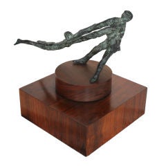 Great Bronze of a man swinging a girl on rotating rosewood base