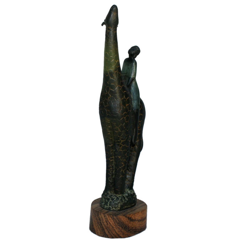 A great bronze-mounted on zebrawood by the noted Coloradan artist Craig Lehmann. He is known for his animal sculpture and his African based themes. This bronze is signed on the bronze base and depicts an African Warrior Woman on a Giraffe. It is