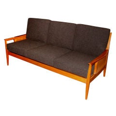 Beautiful caned and upholstered sculptural sofa