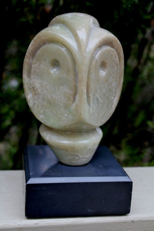 A nice sculpture of an owl's head done in what appears to be soapstone monogrammed MF and dated 1981. It appears to be Inuit or Eskimo. Mounted on a base.
