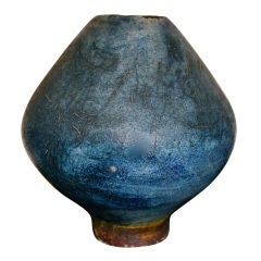 Signed incised large iridescent blue piece of pottery