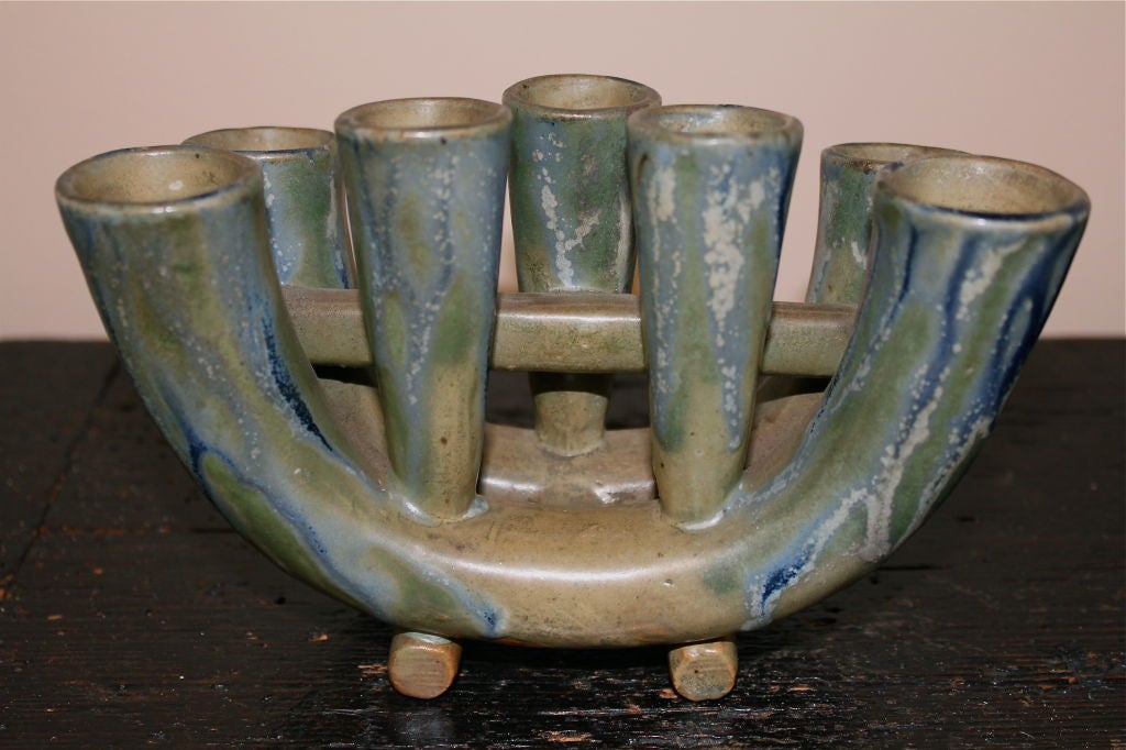A really beautifully glazed candle holder out of a collection of wonderful art pottery. It has a collection sticker on it's base. Great glaze.