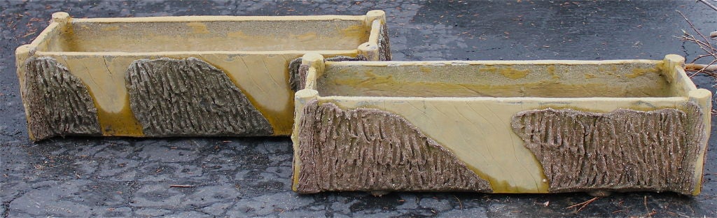 A nice pair of faux Bois planters with nice form. I took the pictures with them slightly wet so you can see how the yellow shows when they are wet.
