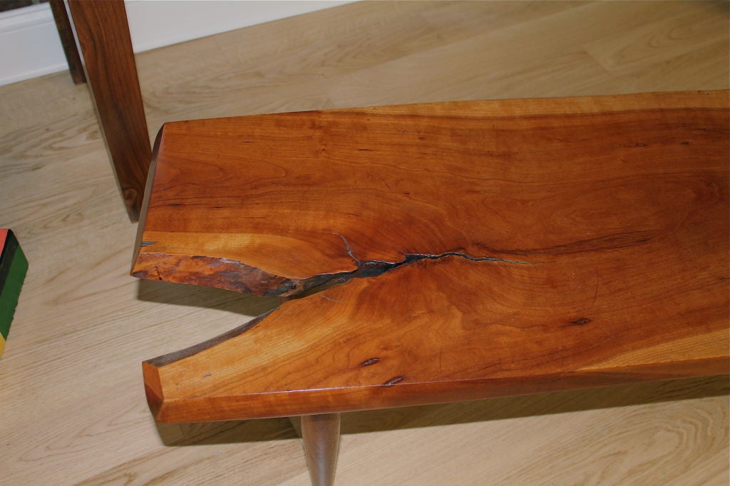 A beautiful craftsman coffee table or bench by the New Hope woodworker James Martin. It is signed on the bottom and comes with the original receipt from 1969. Mr. Martin was a student of George Nakashima and served as an apprentice. It is a lovely