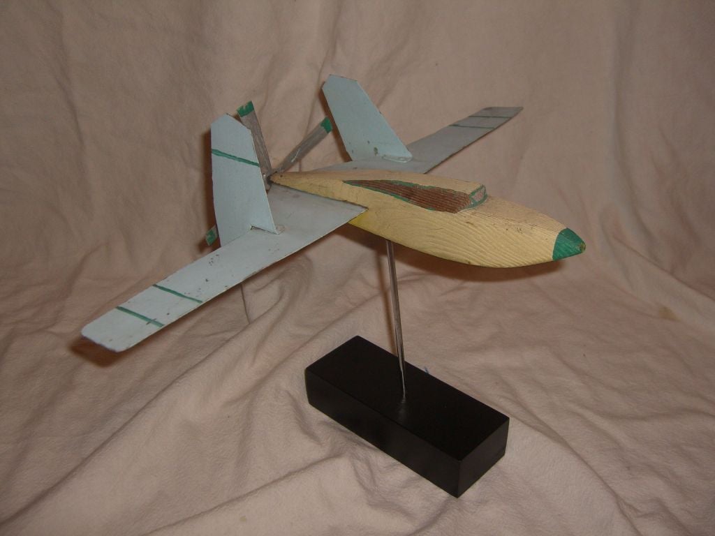 A wonderful hand crafted and carved aircraft design that is signed underneath James Holt. Appears to date to the 1960's on a wood base. Either a hobbyist model or as it is is signed a prototype design.