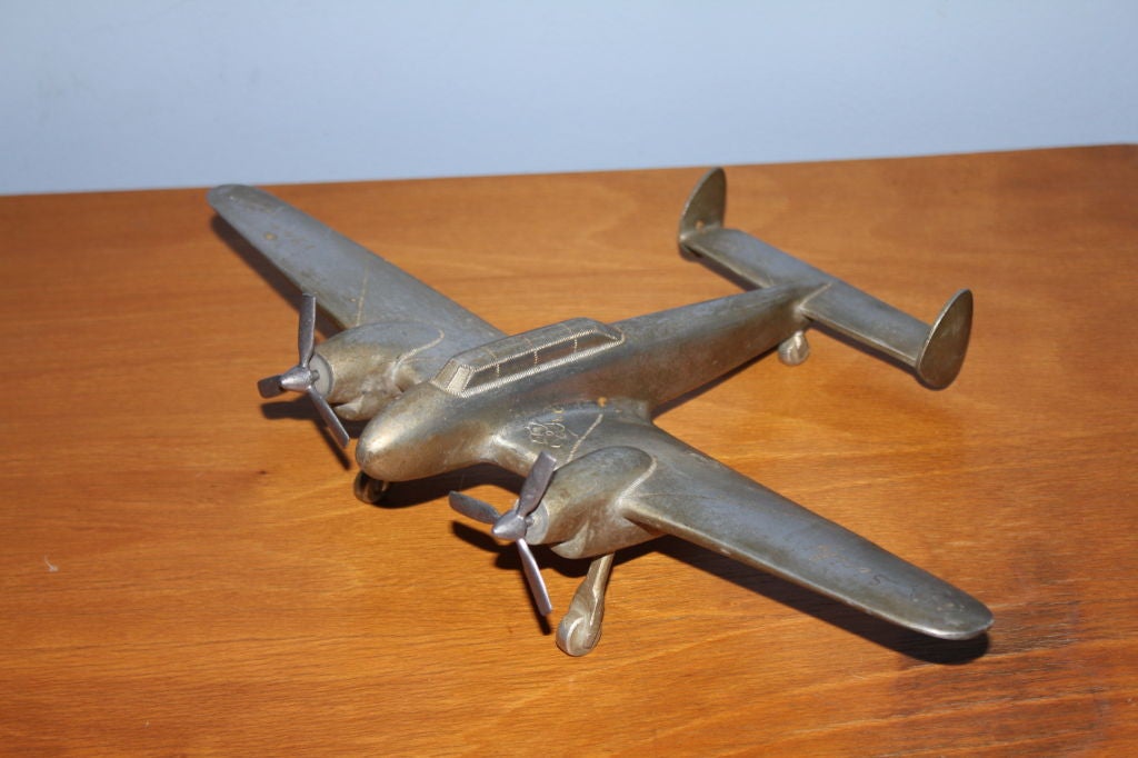 A quite unique piece of trench art is this vintage metal airplane built to commemorate the Allies invasion of Italy in 1944. It is marked Sicily 1944 and is clearly hand made and one of a kind. I'm not sure what kind of plane this is, but the