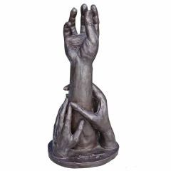 Striking patinated plater sculpture of reaching hands dated 1971