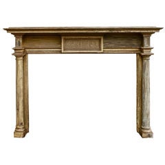 19th century mantel with a neoclassical motif