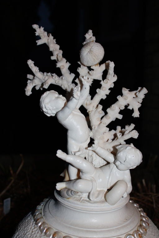 Whimsical sculpture of cherubs, shells, coral, quartz and marble