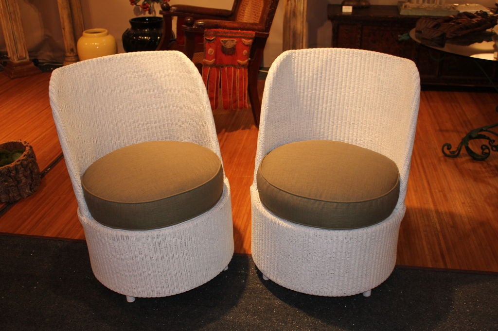 Unusual pair of Lloyd Loom wicker chairs