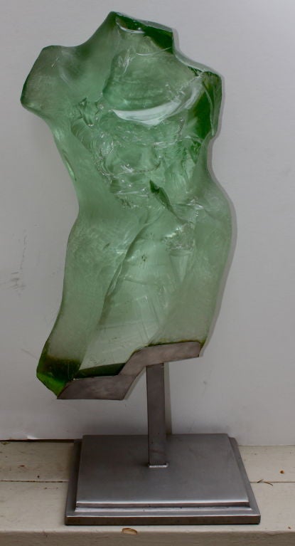 A wonderful chiseled carved and polished glass nude torso by the talented artist Suzanne Pascal. Her style is quite unique. When you read her biography below, you will understand. She was only able to use her technique on heavy 100 year old glass