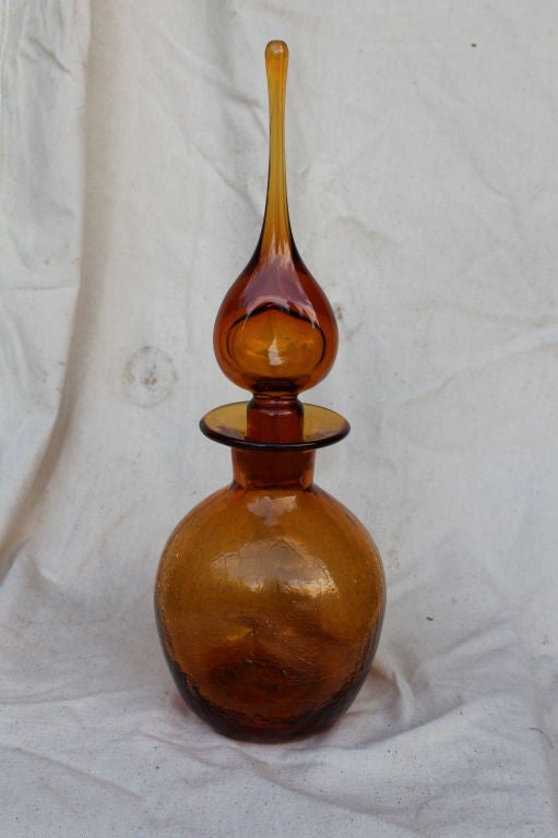 A nice vintage  vase with a large stopper. Nice crackle glaze to the bottle. Very sculptural in design.