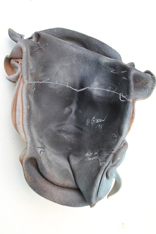 Unusual painted leather mask sculpture signed Gibson 2