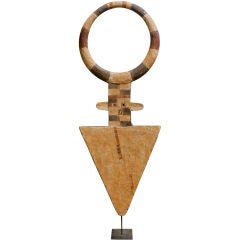 Large carved Painted African sculpture mounted on an iron stand