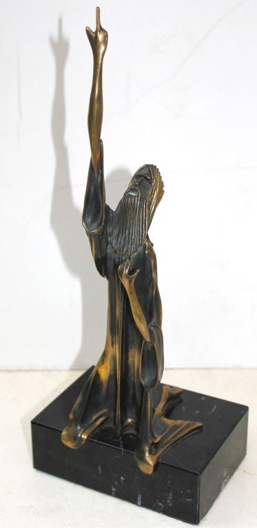 a very early work for the noted artist Tom Bennett. It is from 1974 when he started creating bronzes and is of an edition of 100. This one is numbered 85/100 and signed Tom Bennett 1974. It is titled Moses and I believe he has a few available left