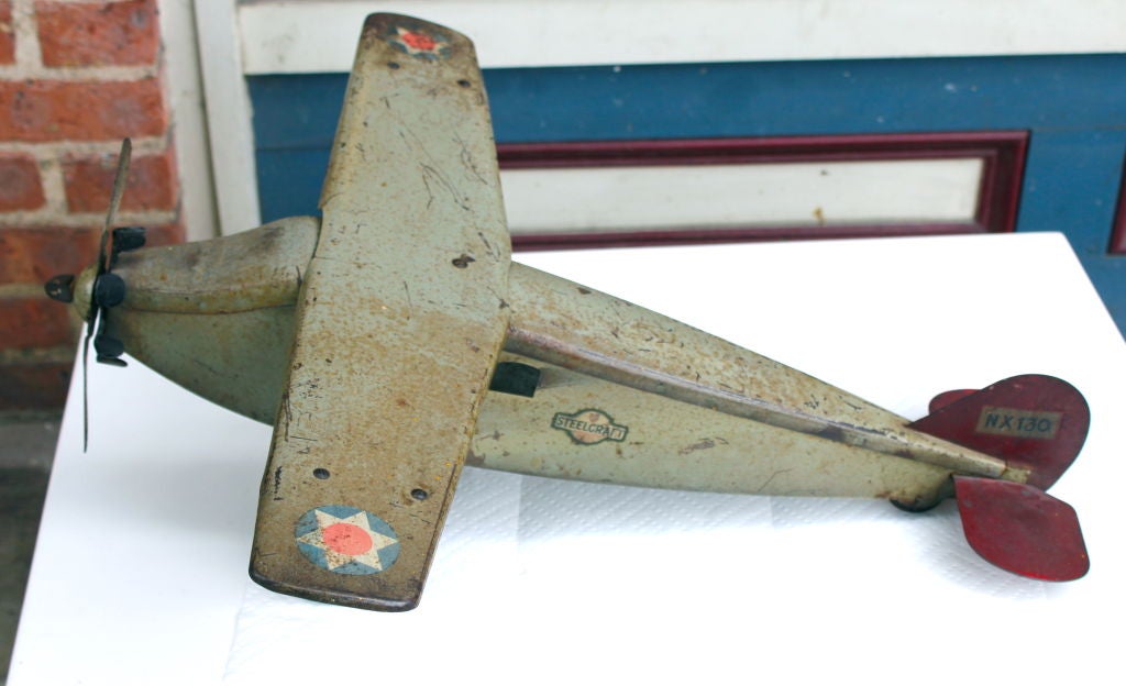 A great looking metal airplane model made by Steelcraft also marked Murray manufacturing company. It dates to the 1920's. I know this was also made as a tri-motor plane version, but that is marked army scout plane and this is not.
