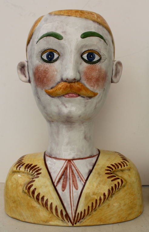 A whimsical pair of Italian Head Vases imported and retailed by the high end frim Horchow. They depict a man and woman. Only the woman is stamped Horchow Made in Italy.