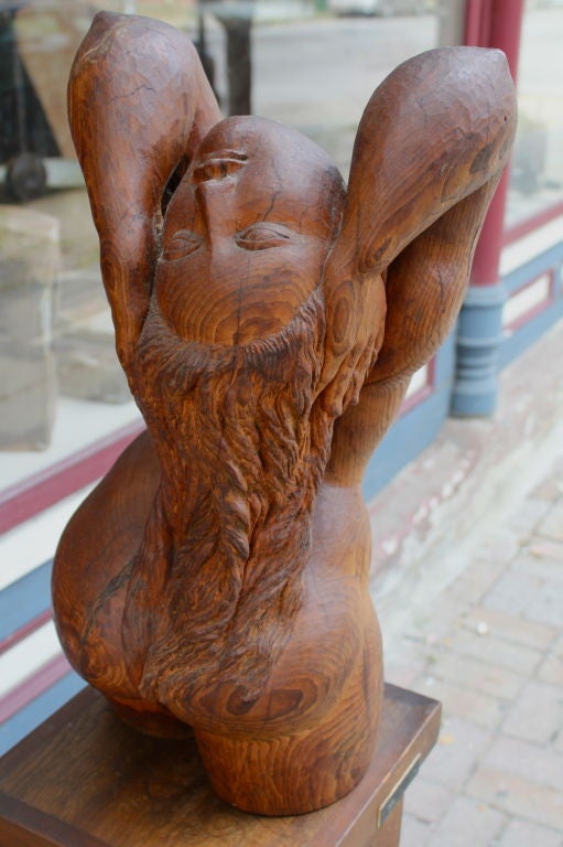 A wonderful carved wood sculpture and base by the noted Canadian artist Ivan Fainmel. The base features a plaque that bears the artist's name and it is signed on the base as well. Nicely done. Sculpture size is 21 inches tall and approx 11 inches in