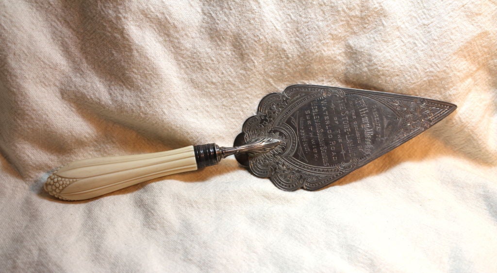 A very nice presentation trowel dated June 22, 1907. It has a lovely carved bone handle and is beautifully engraved.