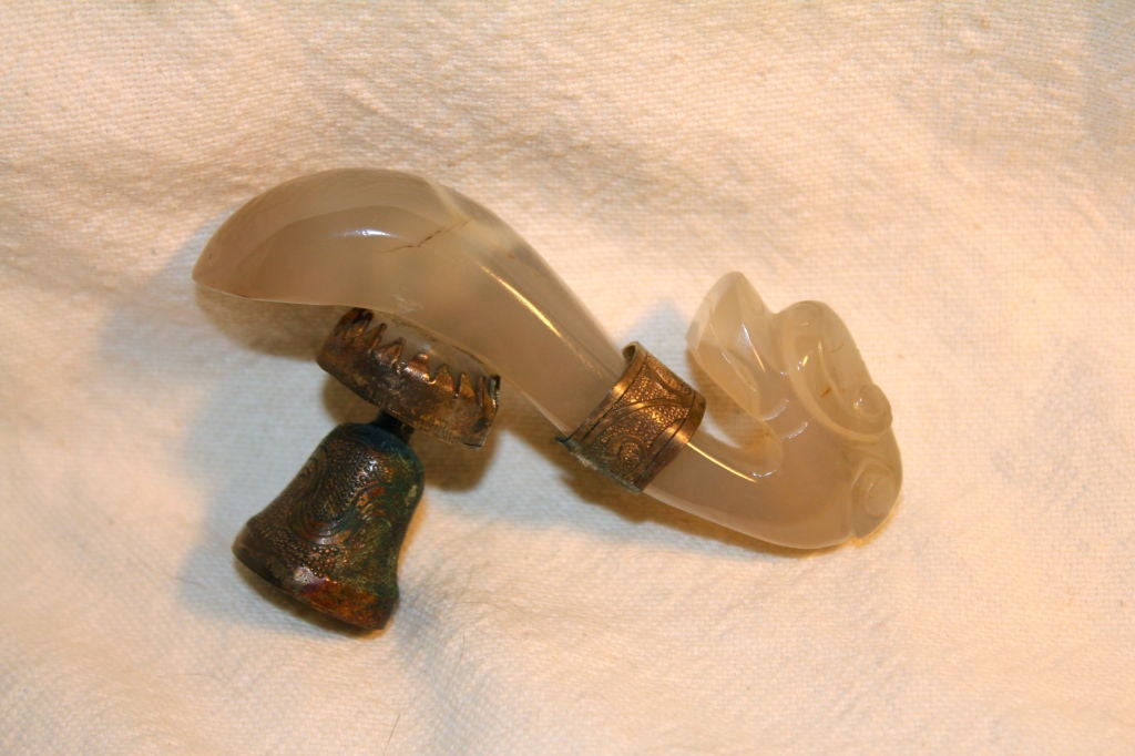 An early 20th century Chinese carved agate belt hook. It is a nice piece of agate and well carved.