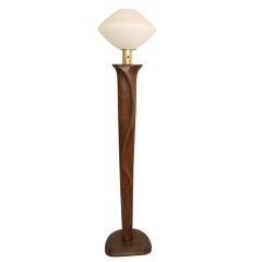 Elegant carved wood floor lamp with frosted glass shade