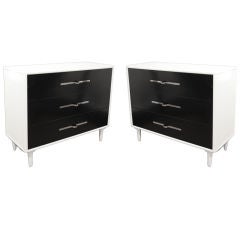 Pair of Tommi Parzinger linen sided lacquered bachelor chests