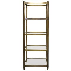 Heavy Brass plated iron etagere with glass shelves