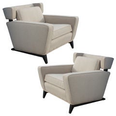 Pair of unusual mid century wing chairs on sleigh legs