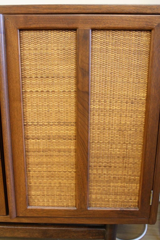 Mid-20th Century American of Martinsville cabinet with caned door aluminum inlay