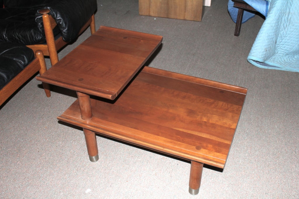 A nicely designed pair of Willett Furniture solid Cherry side or end tables from their Trans-East collection. They probably designed this line after Baker furniture came out with it's Asian lines in the late 1950's. These tables have nice design