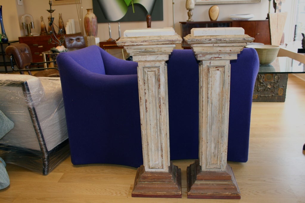Nice pair of distressed painted marble top pedestals