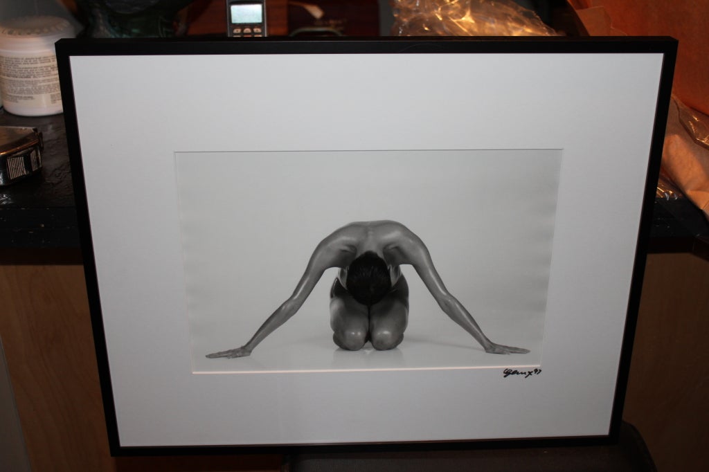 A nice silver gelatin photograph of a nude signed and dated on the matte. It is also inscribed on the back which we photographed before we had it reframed. The signature is illegible.