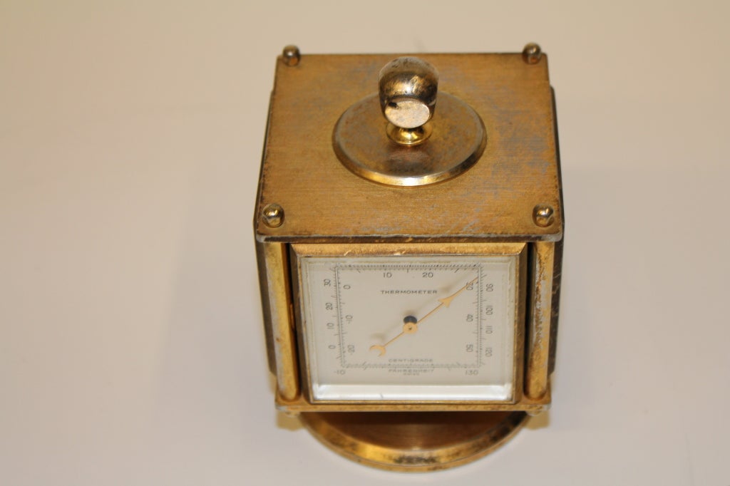A nice vintage weather station retailed by Abercrombie and Fitch but probably with Swiss made parts. Clock works and has been overhauled. The thermometer seems right and the hygrometer and barometer seem to work but I am no expert in this field and