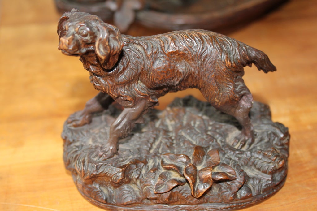 A nice black forest carving inkwell with a dog carved high on top. Two glass inkwells.